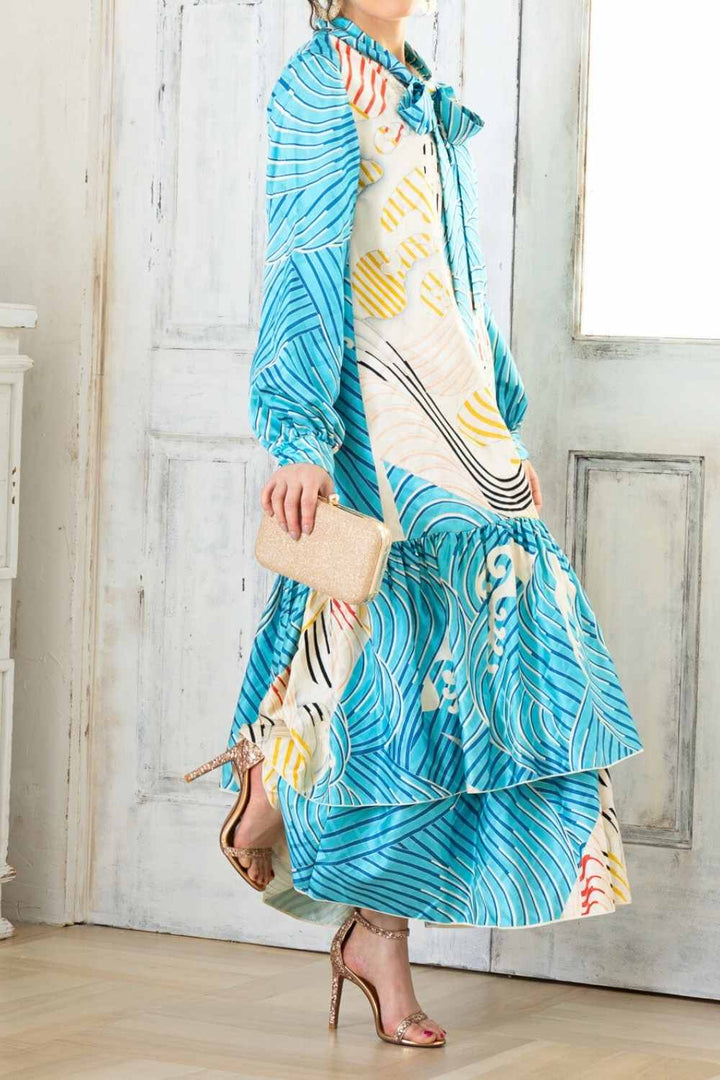 A woman is wearing a wedding guest dress which is also a silk wedding guest dress, showcasing her impeccable style in a stunning fall wedding guest outfit. This long-sleeve party dress, ideal for any special occasion, embodies elegance and sophistication, making her the epitome of grace and charm. Whether it's a tea party dress with delicate details or a chic cocktail dress that exudes confidence, her choice of wedding guest clothes reflects her fashion-forward sensibilities.