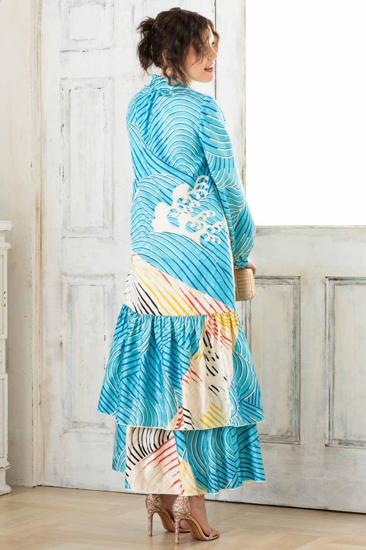 A woman is wearing a wedding guest dress which is also a silk wedding guest dress, showcasing her impeccable style in a stunning fall wedding guest outfit. This long-sleeve party dress, ideal for any special occasion, embodies elegance and sophistication, making her the epitome of grace and charm. Whether it's a tea party dress with delicate details or a chic cocktail dress that exudes confidence, her choice of wedding guest clothes reflects her fashion-forward sensibilities.