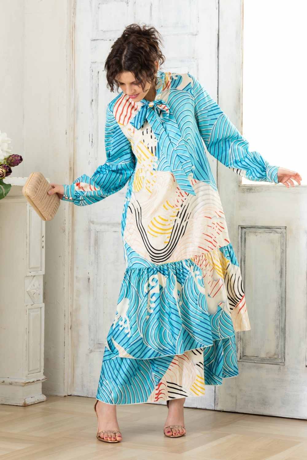 A woman is wearing a wedding guest dress which is also a silk wedding guest dress, showcasing her impeccable style in a stunning fall wedding guest outfit. This long-sleeve party dress, ideal for any special occasion, embodies elegance and sophistication, making her the epitome of grace and charm. Whether it's a tea party dress with delicate details or a chic cocktail dress that exudes confidence, her choice of wedding guest clothes reflects her fashion-forward sensibilities.