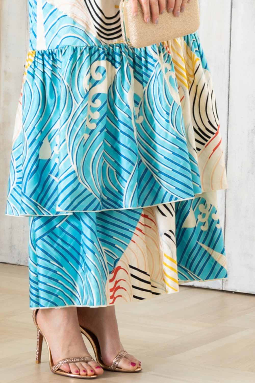 A woman is wearing a wedding guest dress which is also a silk wedding guest dress, showcasing her impeccable style in a stunning fall wedding guest outfit. This long-sleeve party dress, ideal for any special occasion, embodies elegance and sophistication, making her the epitome of grace and charm. Whether it's a tea party dress with delicate details or a chic cocktail dress that exudes confidence, her choice of wedding guest clothes reflects her fashion-forward sensibilities.