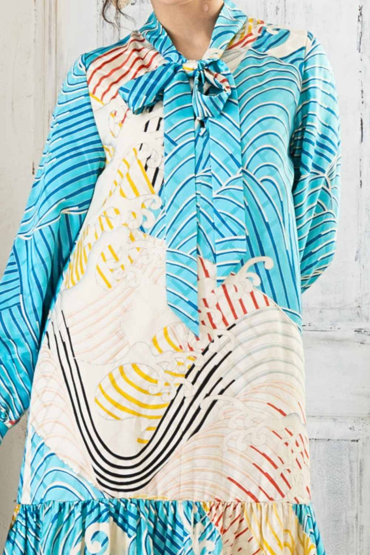 A woman is wearing a wedding guest dress which is also a silk wedding guest dress, showcasing her impeccable style in a stunning fall wedding guest outfit. This long-sleeve party dress, ideal for any special occasion, embodies elegance and sophistication, making her the epitome of grace and charm. Whether it's a tea party dress with delicate details or a chic cocktail dress that exudes confidence, her choice of wedding guest clothes reflects her fashion-forward sensibilities.