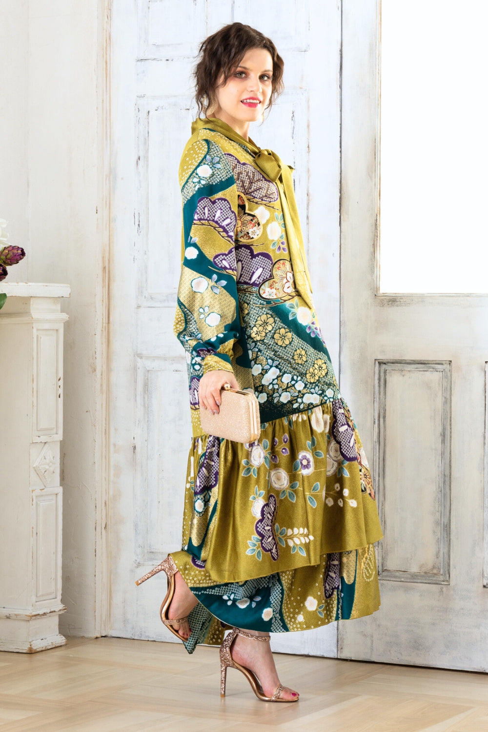 A woman is wearing a wedding guest dress which is also a silk wedding guest dress, showcasing her impeccable style in a stunning fall wedding guest outfit. This long-sleeve party dress, ideal for any special occasion, embodies elegance and sophistication, making her the epitome of grace and charm. Whether it's a tea party dress with delicate details or a chic cocktail dress that exudes confidence, her choice of wedding guest clothes reflects her fashion-forward sensibilities.