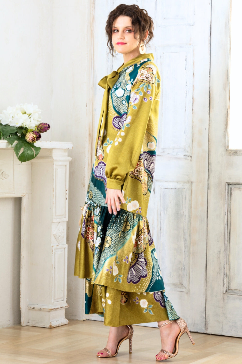 A woman is wearing a wedding guest dress which is also a silk wedding guest dress, showcasing her impeccable style in a stunning fall wedding guest outfit. This long-sleeve party dress, ideal for any special occasion, embodies elegance and sophistication, making her the epitome of grace and charm. Whether it's a tea party dress with delicate details or a chic cocktail dress that exudes confidence, her choice of wedding guest clothes reflects her fashion-forward sensibilities.