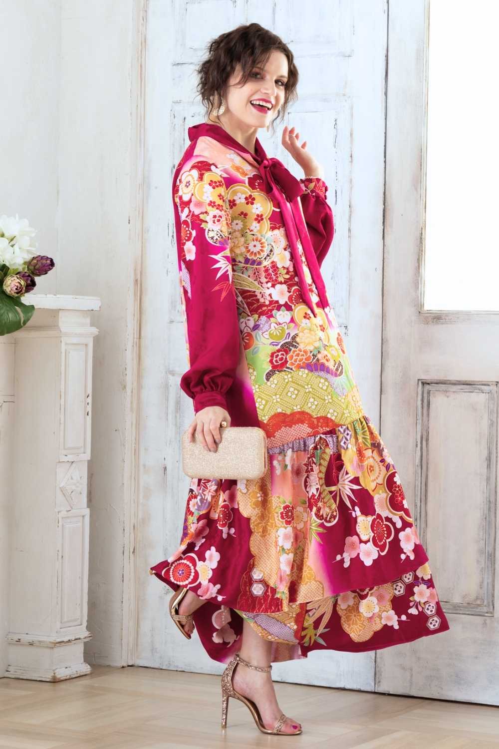 A woman is wearing a wedding guest dress which is also a silk wedding guest dress, showcasing her impeccable style in a stunning fall wedding guest outfit. This long-sleeve party dress, ideal for any special occasion, embodies elegance and sophistication, making her the epitome of grace and charm. Whether it's a tea party dress with delicate details or a chic cocktail dress that exudes confidence, her choice of wedding guest clothes reflects her fashion-forward sensibilities.
