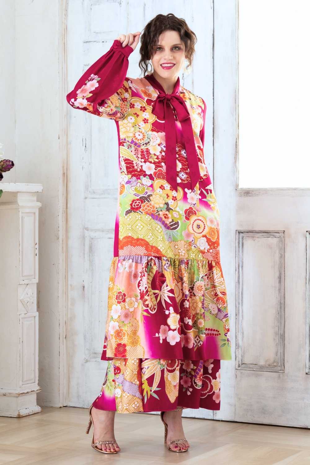 A woman is wearing a wedding guest dress which is also a silk wedding guest dress, showcasing her impeccable style in a stunning fall wedding guest outfit. This long-sleeve party dress, ideal for any special occasion, embodies elegance and sophistication, making her the epitome of grace and charm. Whether it's a tea party dress with delicate details or a chic cocktail dress that exudes confidence, her choice of wedding guest clothes reflects her fashion-forward sensibilities.