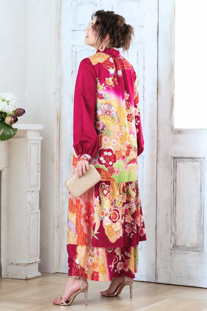 A woman is wearing a wedding guest dress which is also a silk wedding guest dress, showcasing her impeccable style in a stunning fall wedding guest outfit. This long-sleeve party dress, ideal for any special occasion, embodies elegance and sophistication, making her the epitome of grace and charm. Whether it's a tea party dress with delicate details or a chic cocktail dress that exudes confidence, her choice of wedding guest clothes reflects her fashion-forward sensibilities.