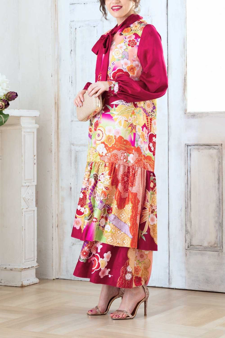 A woman is wearing a wedding guest dress which is also a silk wedding guest dress, showcasing her impeccable style in a stunning fall wedding guest outfit. This long-sleeve party dress, ideal for any special occasion, embodies elegance and sophistication, making her the epitome of grace and charm. Whether it's a tea party dress with delicate details or a chic cocktail dress that exudes confidence, her choice of wedding guest clothes reflects her fashion-forward sensibilities.