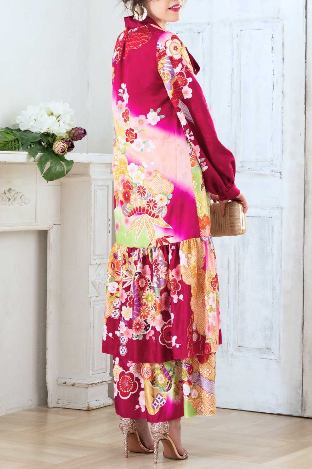 A woman is wearing a wedding guest dress which is also a silk wedding guest dress, showcasing her impeccable style in a stunning fall wedding guest outfit. This long-sleeve party dress, ideal for any special occasion, embodies elegance and sophistication, making her the epitome of grace and charm. Whether it's a tea party dress with delicate details or a chic cocktail dress that exudes confidence, her choice of wedding guest clothes reflects her fashion-forward sensibilities.