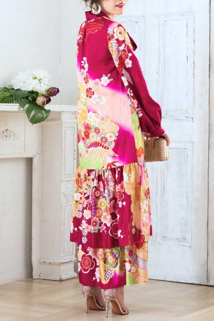 A woman is wearing a wedding guest dress which is also a silk wedding guest dress, showcasing her impeccable style in a stunning fall wedding guest outfit. This long-sleeve party dress, ideal for any special occasion, embodies elegance and sophistication, making her the epitome of grace and charm. Whether it's a tea party dress with delicate details or a chic cocktail dress that exudes confidence, her choice of wedding guest clothes reflects her fashion-forward sensibilities.