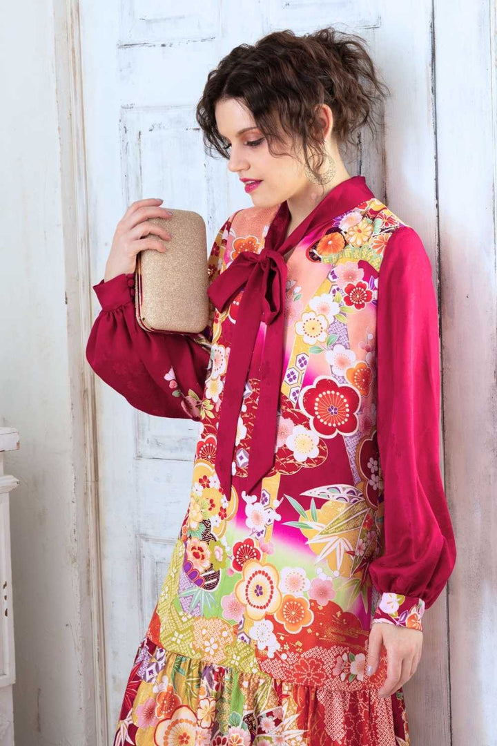 A woman is wearing a wedding guest dress which is also a silk wedding guest dress, showcasing her impeccable style in a stunning fall wedding guest outfit. This long-sleeve party dress, ideal for any special occasion, embodies elegance and sophistication, making her the epitome of grace and charm. Whether it's a tea party dress with delicate details or a chic cocktail dress that exudes confidence, her choice of wedding guest clothes reflects her fashion-forward sensibilities.