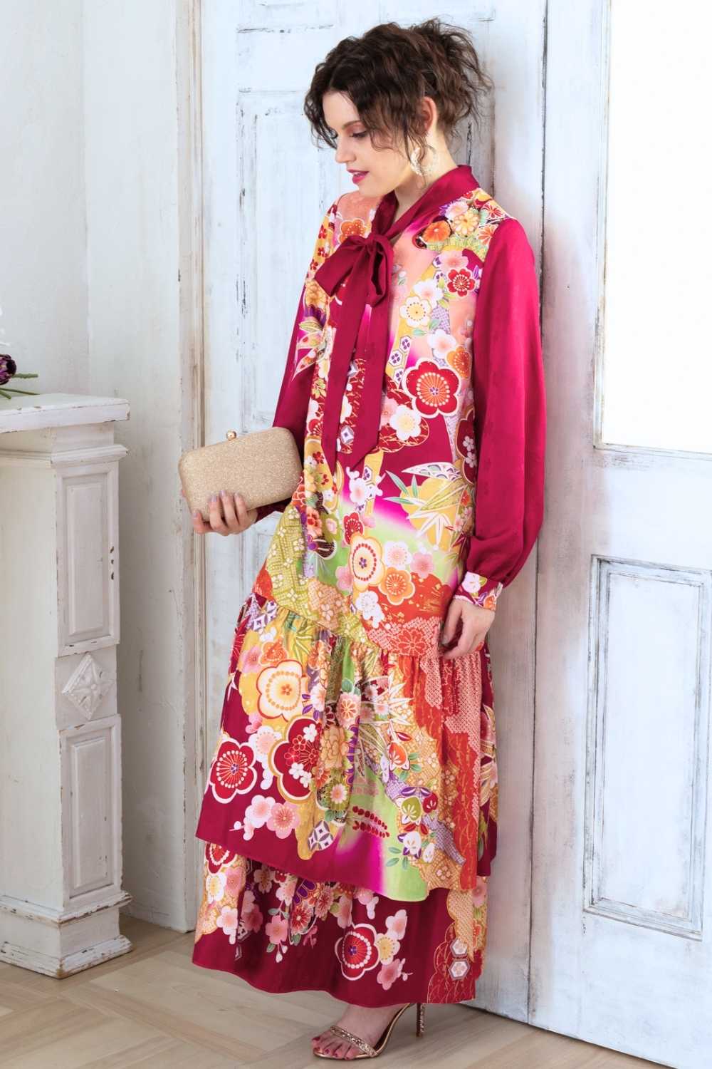 A woman is wearing a wedding guest dress which is also a silk wedding guest dress, showcasing her impeccable style in a stunning fall wedding guest outfit. This long-sleeve party dress, ideal for any special occasion, embodies elegance and sophistication, making her the epitome of grace and charm. Whether it's a tea party dress with delicate details or a chic cocktail dress that exudes confidence, her choice of wedding guest clothes reflects her fashion-forward sensibilities.