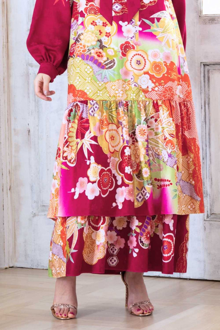 A woman is wearing a wedding guest dress which is also a silk wedding guest dress, showcasing her impeccable style in a stunning fall wedding guest outfit. This long-sleeve party dress, ideal for any special occasion, embodies elegance and sophistication, making her the epitome of grace and charm. Whether it's a tea party dress with delicate details or a chic cocktail dress that exudes confidence, her choice of wedding guest clothes reflects her fashion-forward sensibilities.