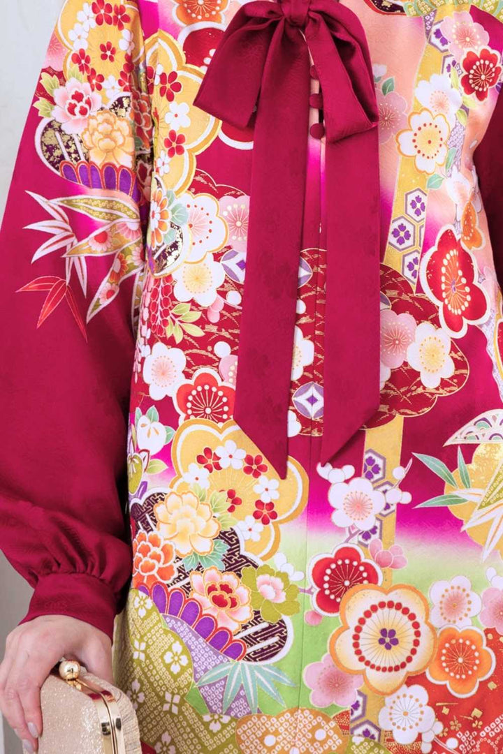 A woman is wearing a wedding guest dress which is also a silk wedding guest dress, showcasing her impeccable style in a stunning fall wedding guest outfit. This long-sleeve party dress, ideal for any special occasion, embodies elegance and sophistication, making her the epitome of grace and charm. Whether it's a tea party dress with delicate details or a chic cocktail dress that exudes confidence, her choice of wedding guest clothes reflects her fashion-forward sensibilities.