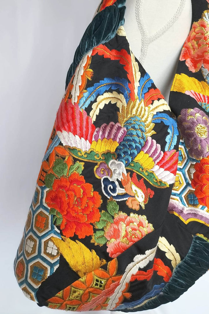 a stunning embroidered boho bag, showcasing the intricate details on this large tote bag. This large boho bag elevates anyones style and is an example of embroidered tote bag styling.
